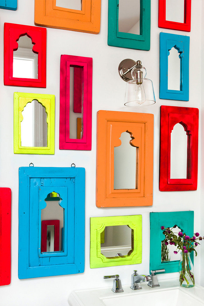 multicolored mirrors hanging on the wall