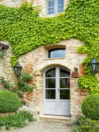 Tuscan farmhouse with gray door