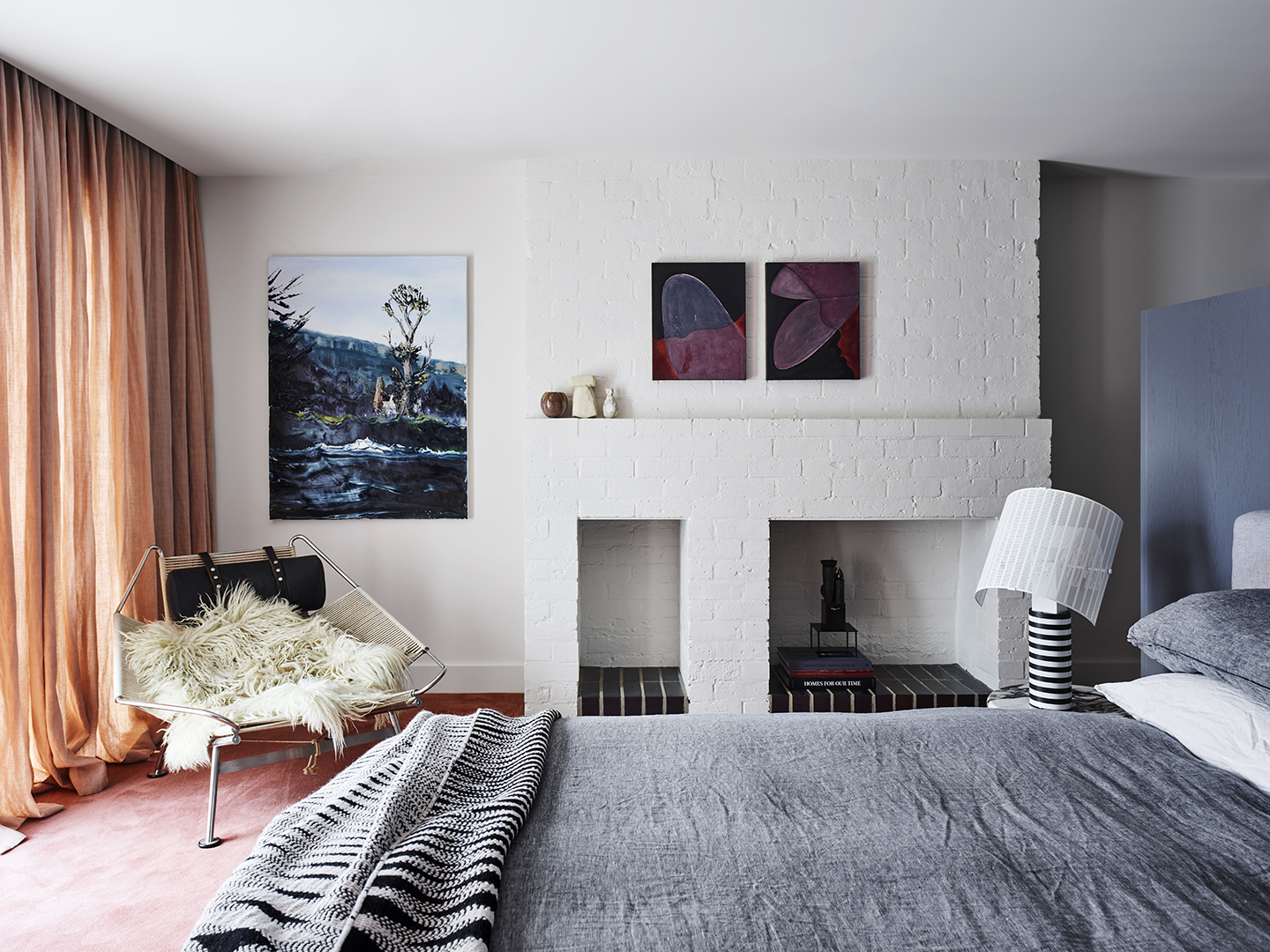 bedroom with grey bed and peach curtains