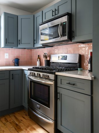 green cabinets with pink backsplash