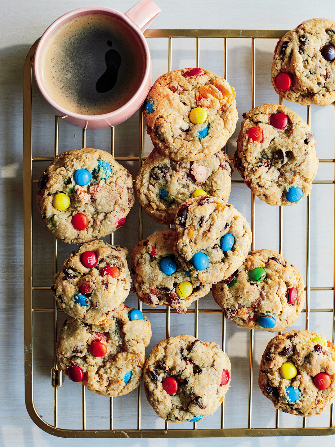 m&M cookies with mug of coffee