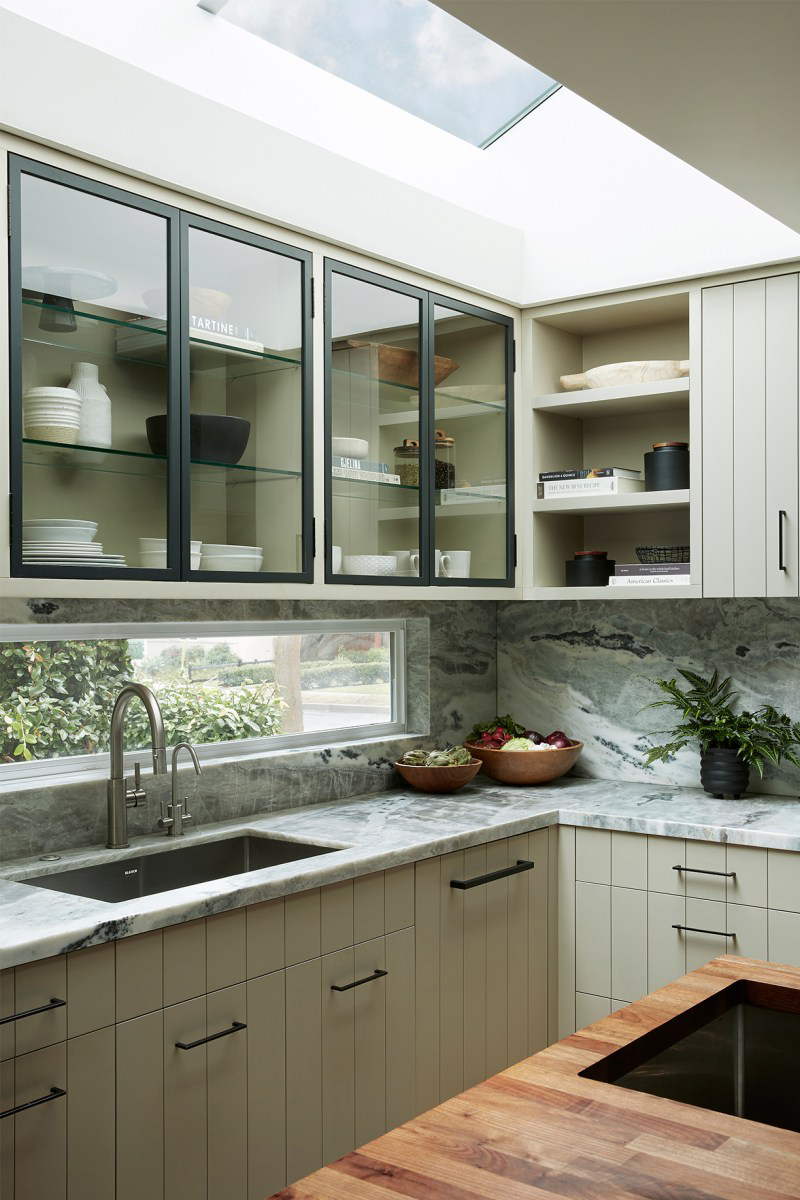 beaded cabinets in a kitchen with thin backsplash window