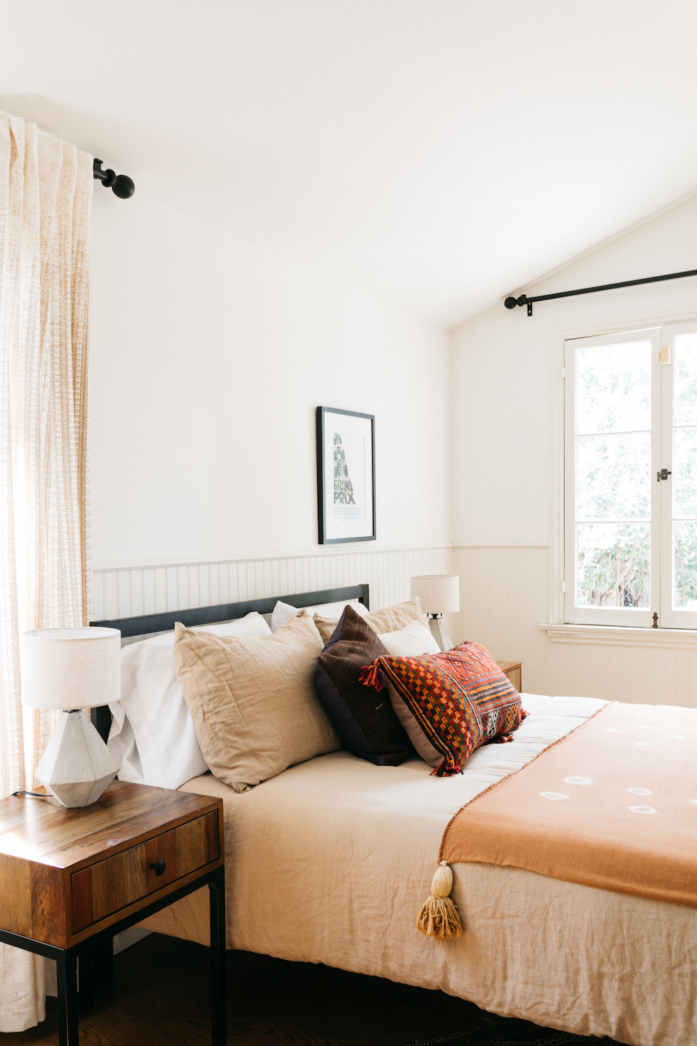 white bedroom with coral bedding