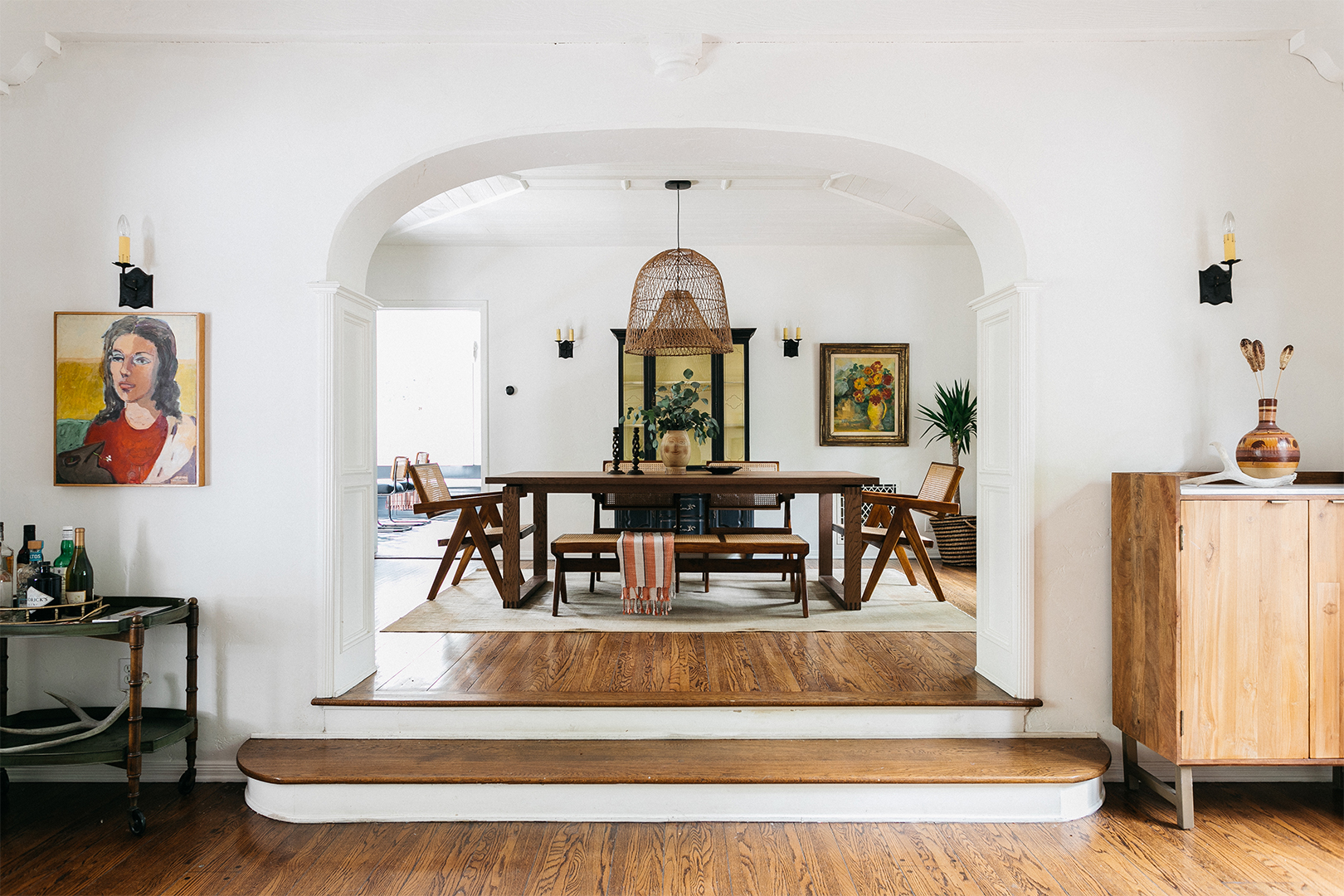 white archway with wood steps