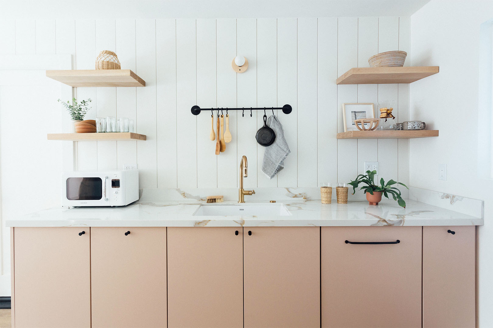 natural wood cabinets and shiplap backsplash