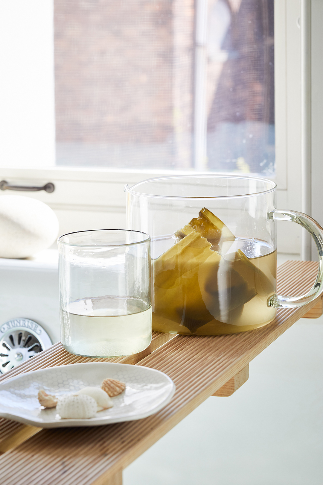 glass containers filled with seaweed