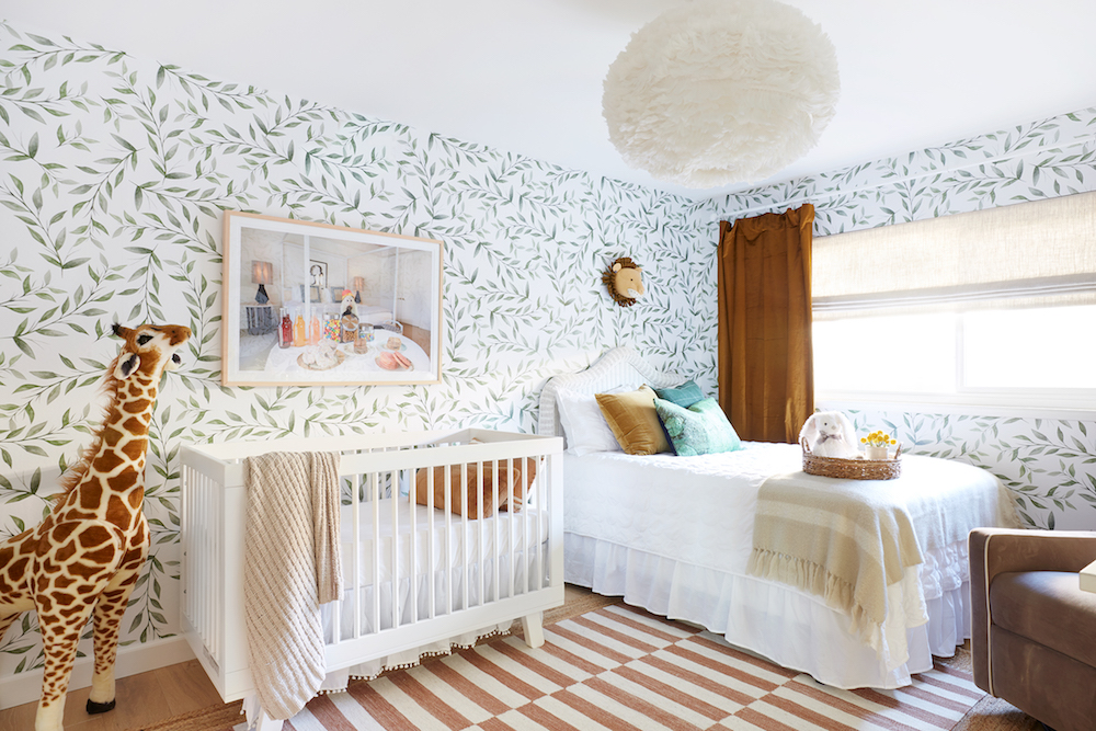 Amber Sokolowski Nursery with leafy wallpaper and gold velvet curtains