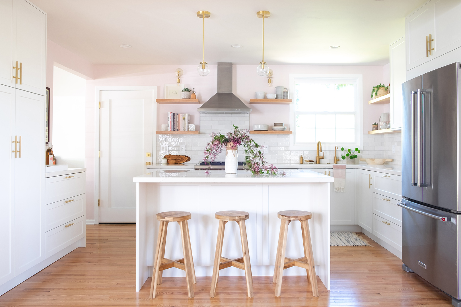 white island in a pink kitchen