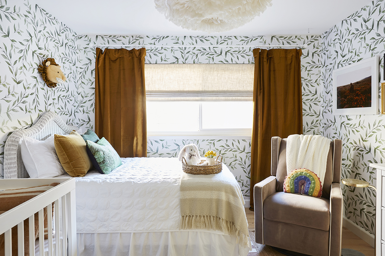 Nursery with leafy wallpaper and gold velvet curtains