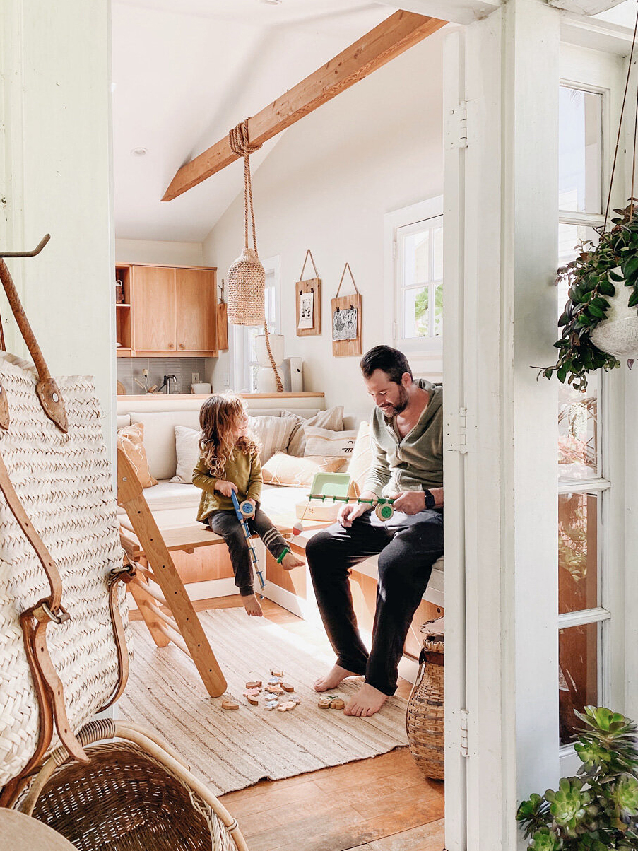 father and son sitting in living room