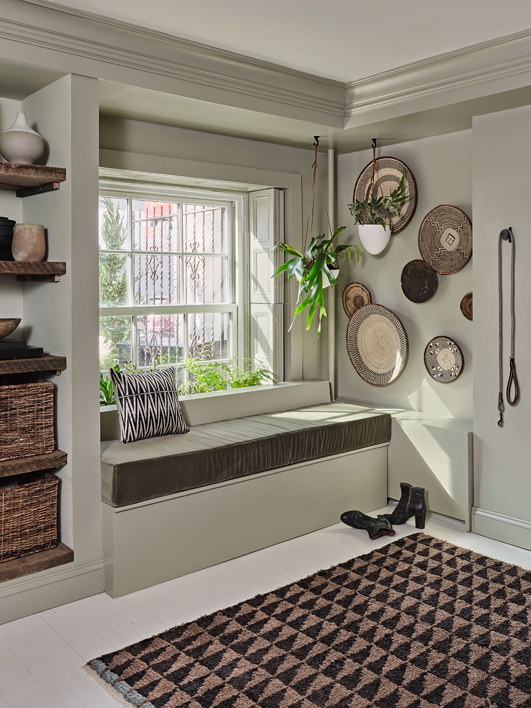 green entryway nook with hanging baskets