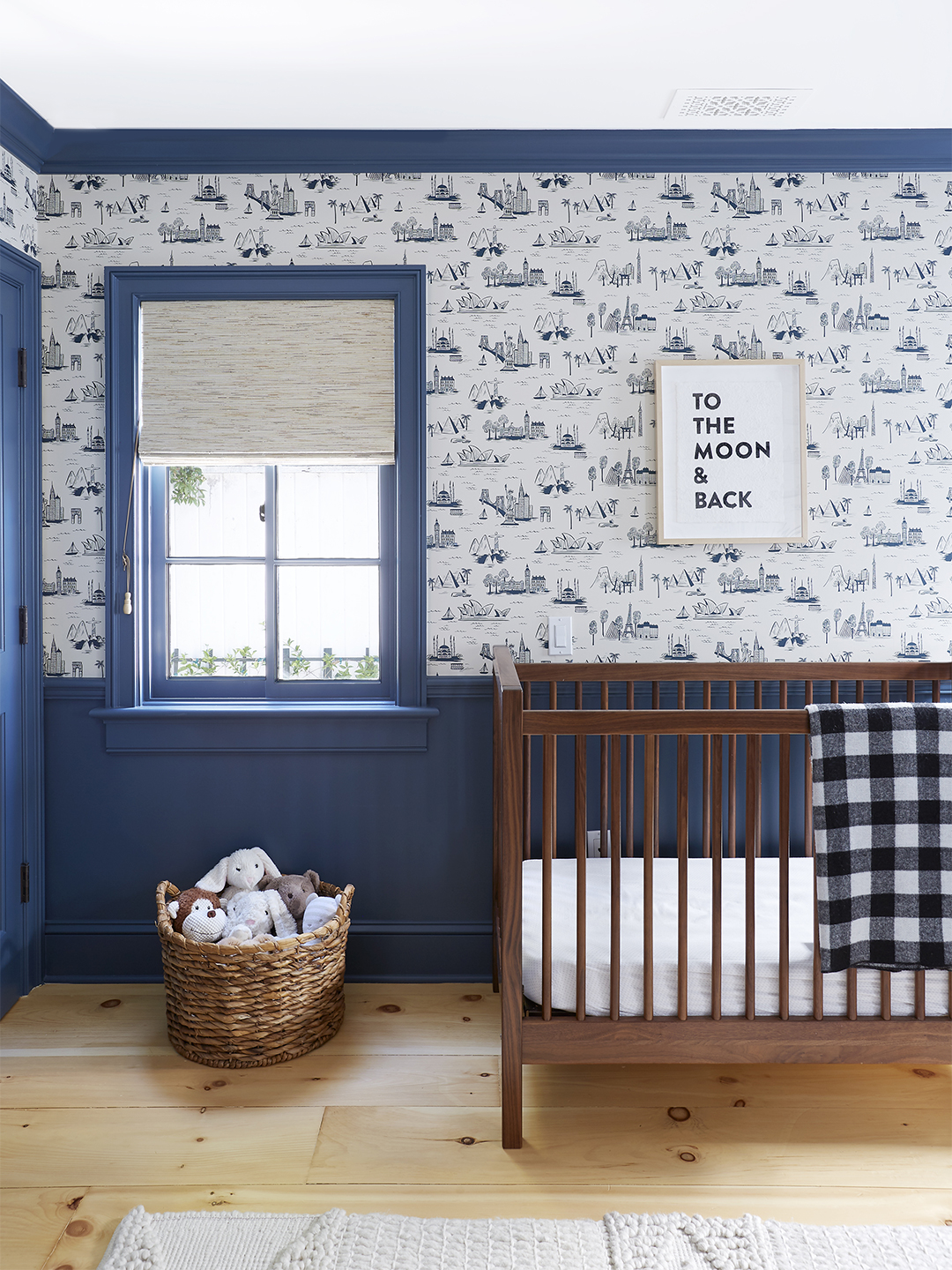 Nursery with blue and white wallpaper