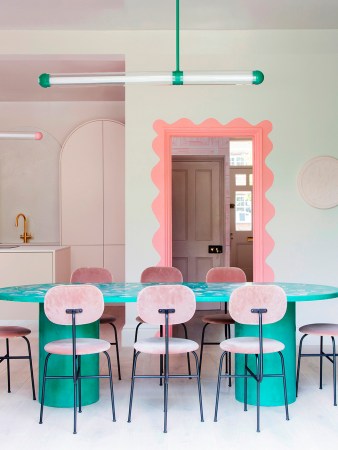 teal dining table and pink chairs