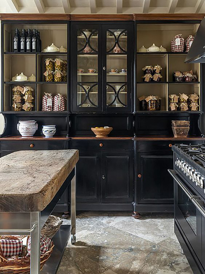 black tuscan kitchen with wooden counters