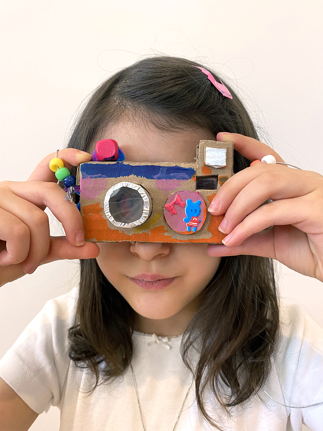 girl holding camera