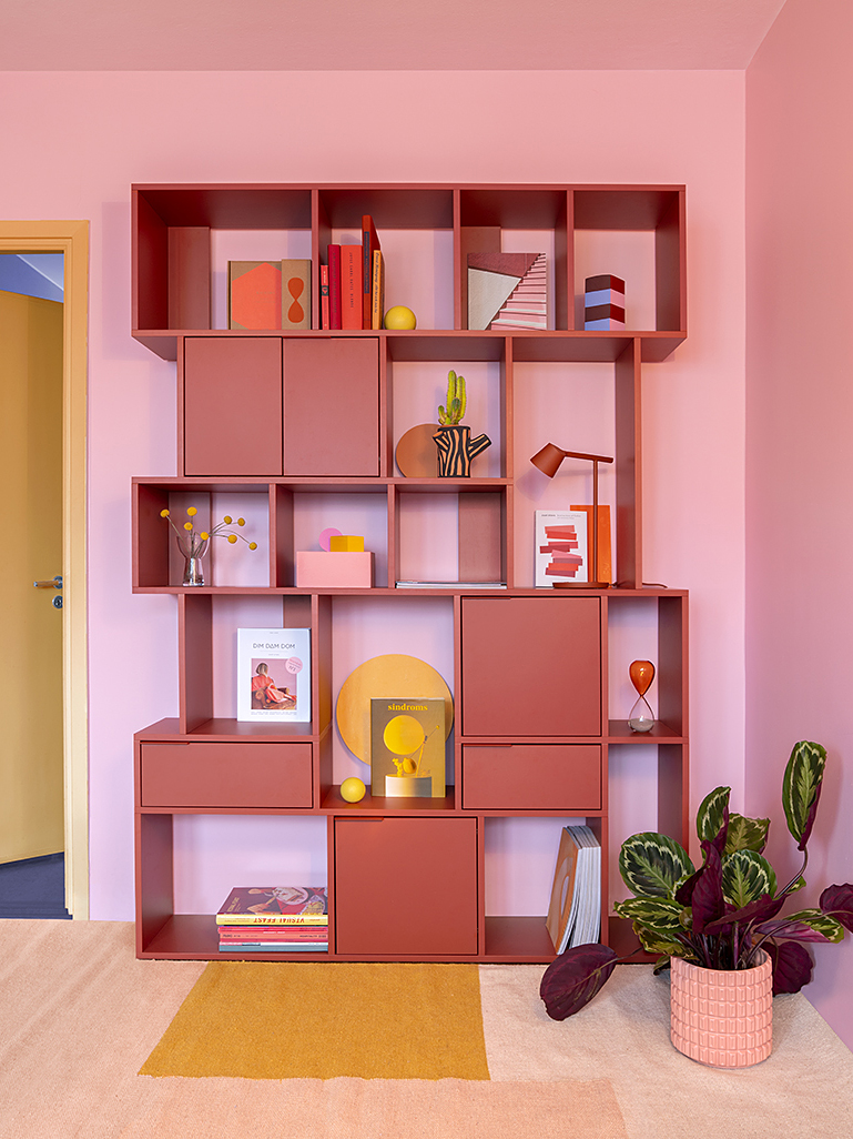 pink wall pink bookshelf