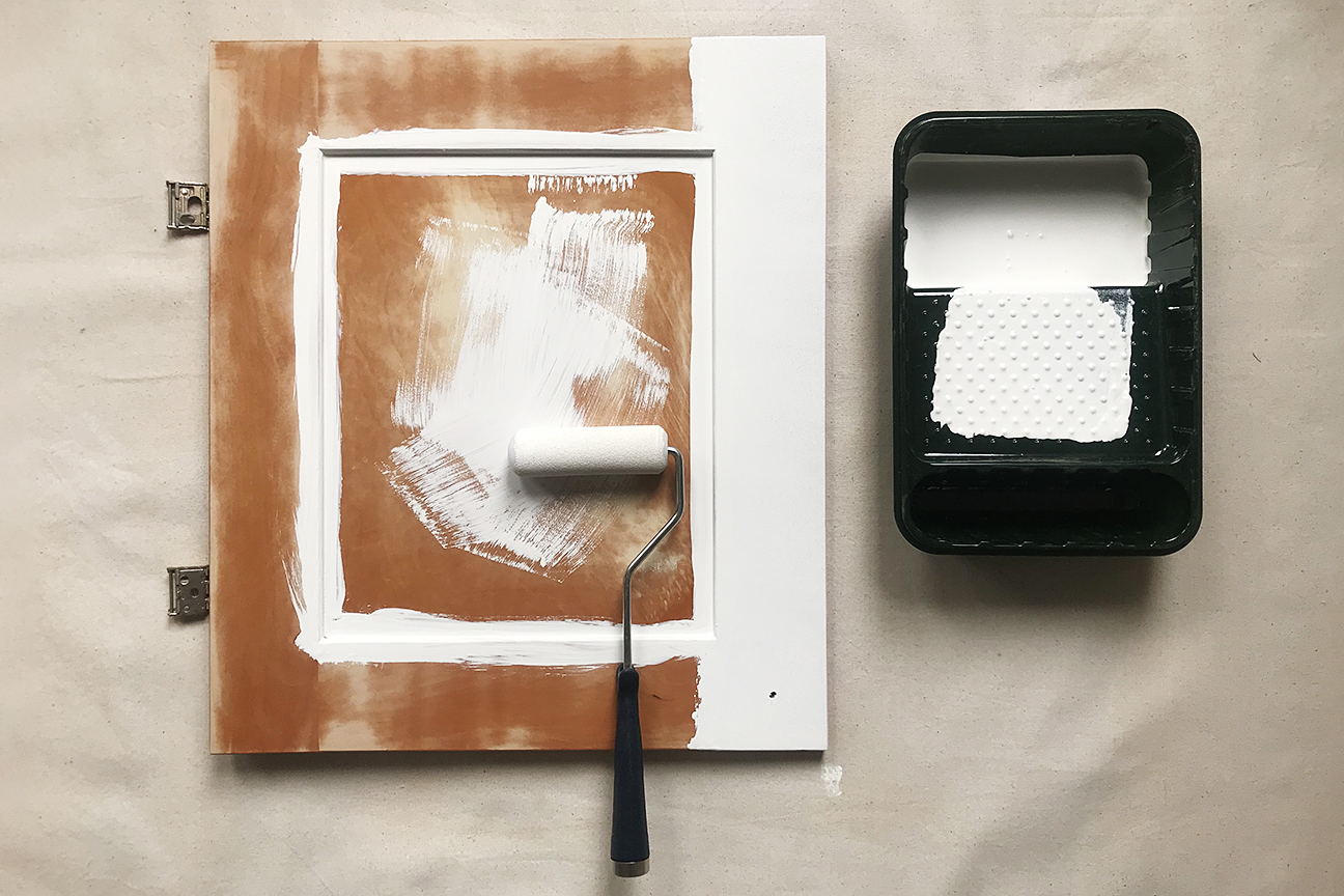 Cabinet door being painted