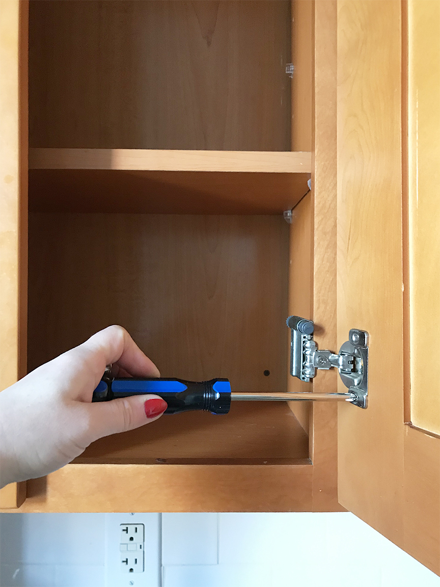 Unscrewing cabinet doors