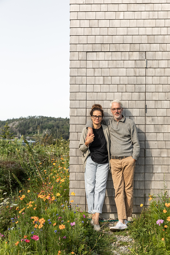 man and woman leaning against a door