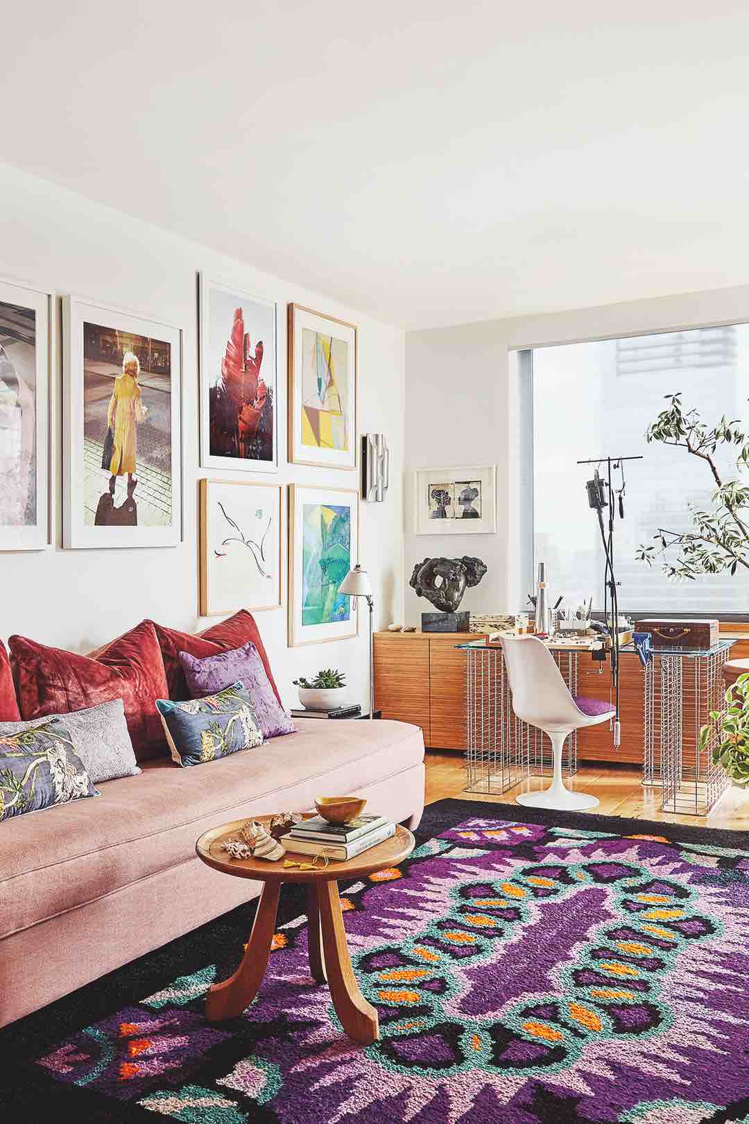 Living room with wall art and pink sofa