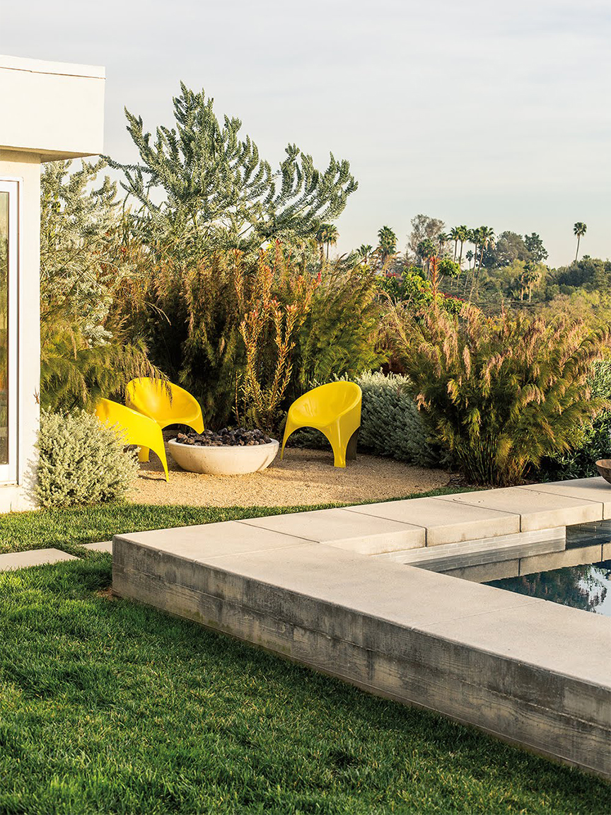 backyard with yellow chairs