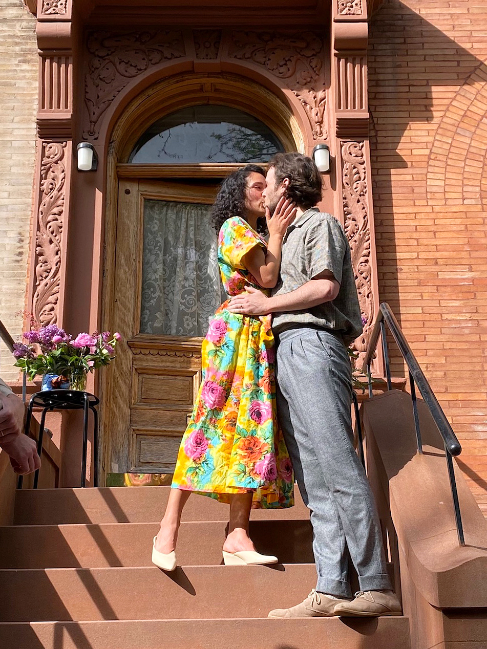 couple kissing on steps