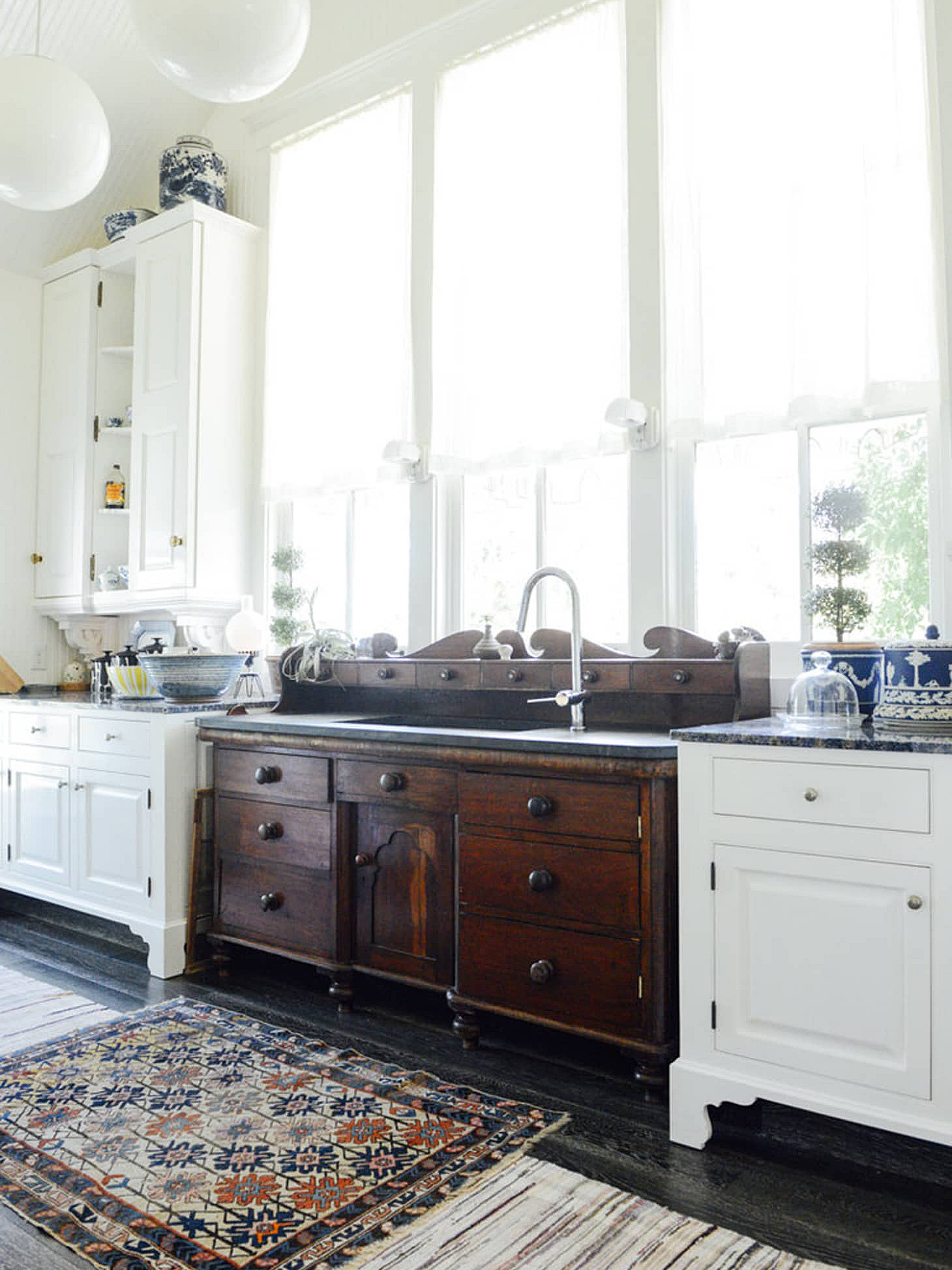 white kitchen with antique wooden sink