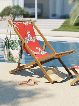 red zebra scalamandre folding chair by pool