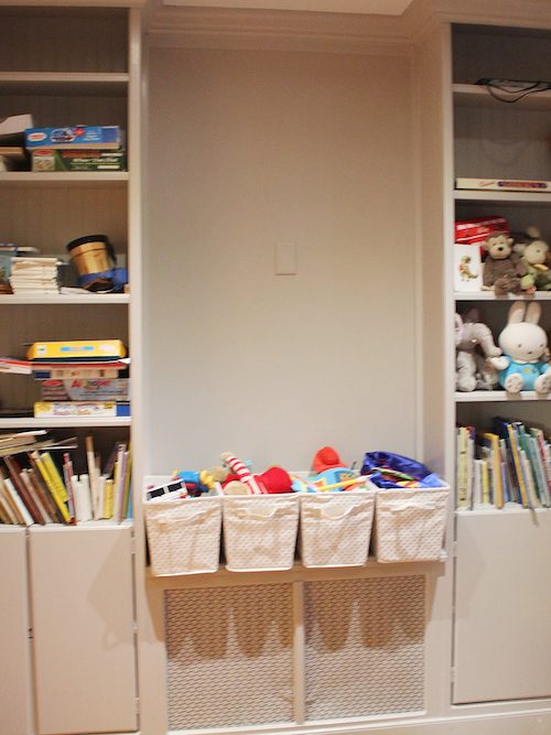 beige bookcase with baskets