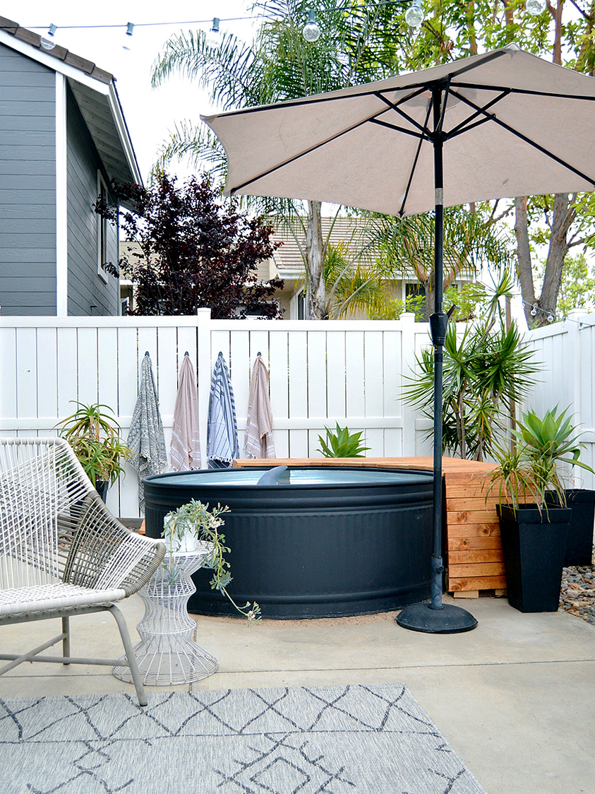 umbrella over backyard stock tank pool