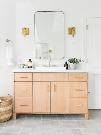 wooden vanity in bathroom with grey tiles