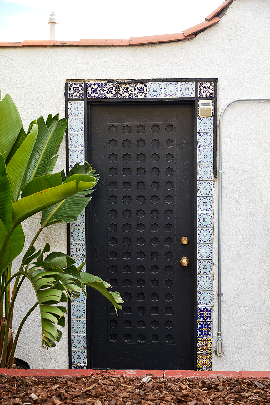 ornate door painted black