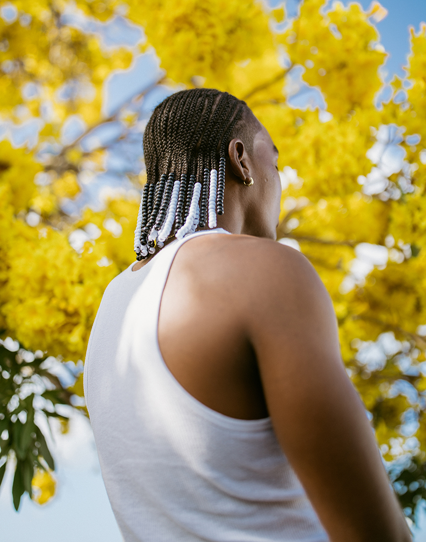 Portrait of person in front of a tree