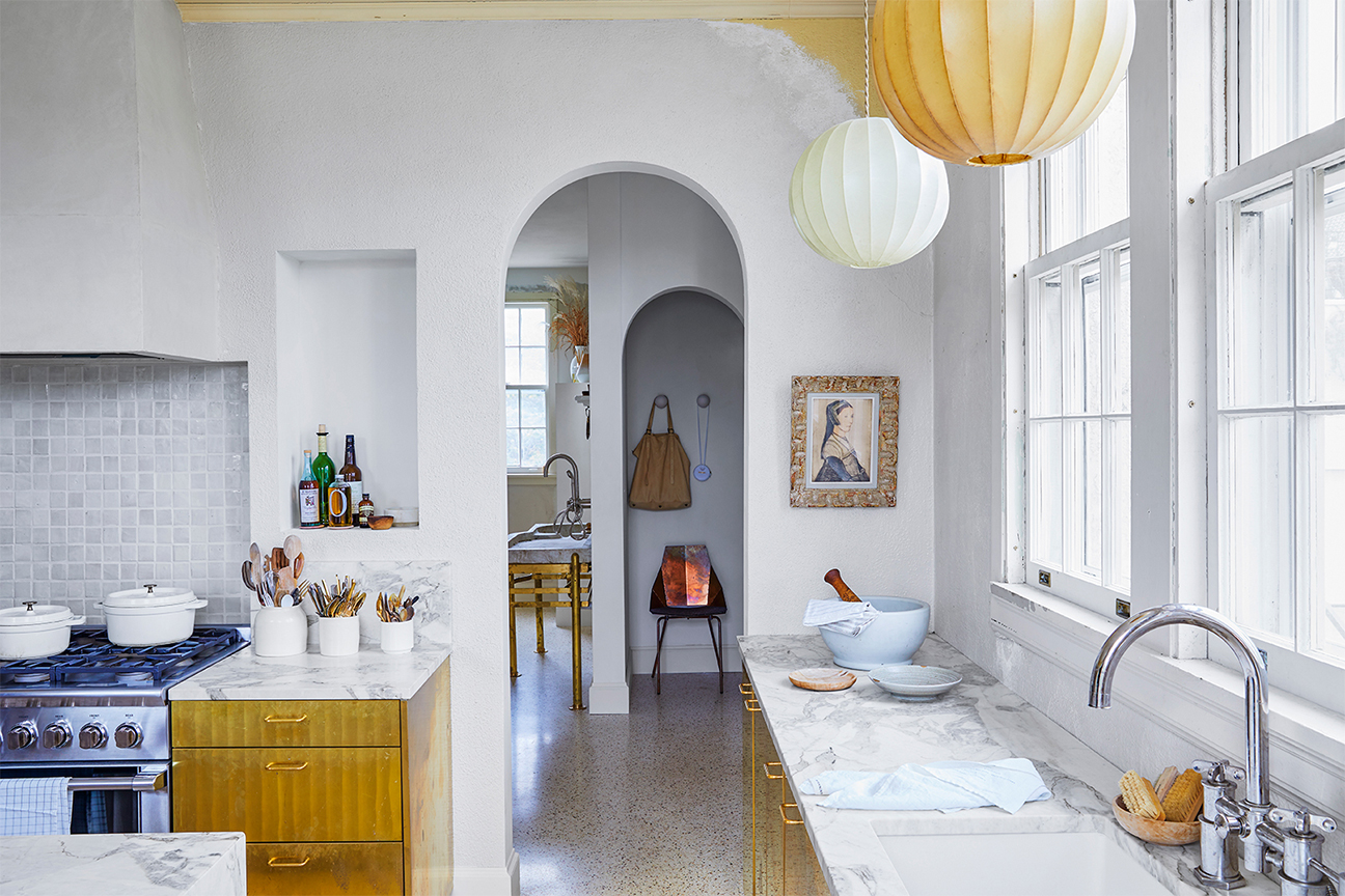 Kitchen with brass cabinets