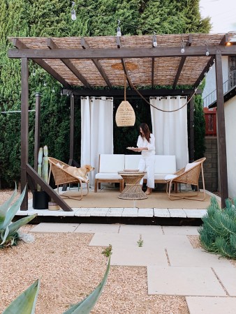 woman styling a pergola