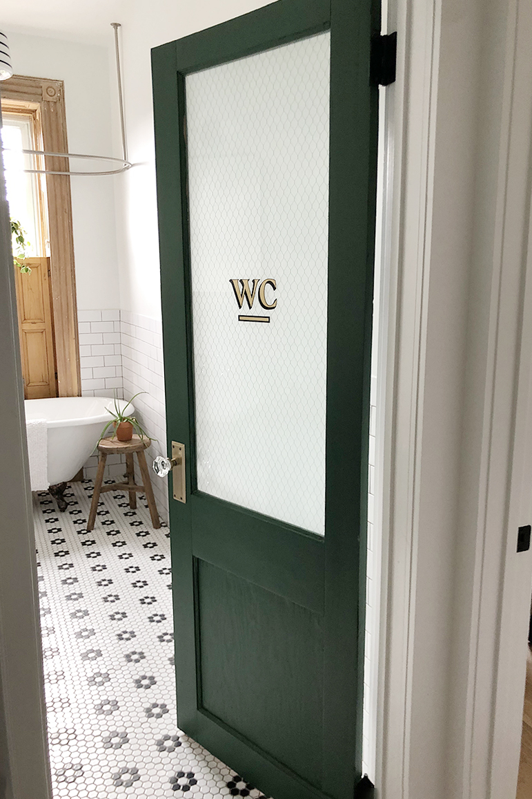 Vintage green door with chicken wire glass