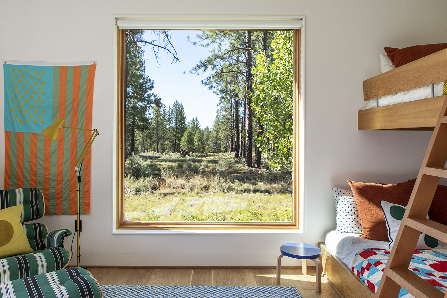 Kids room with bunk beds and Eames chair