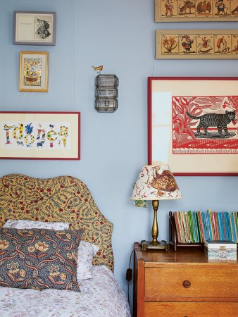 floral headboard surrounded by gallery wall