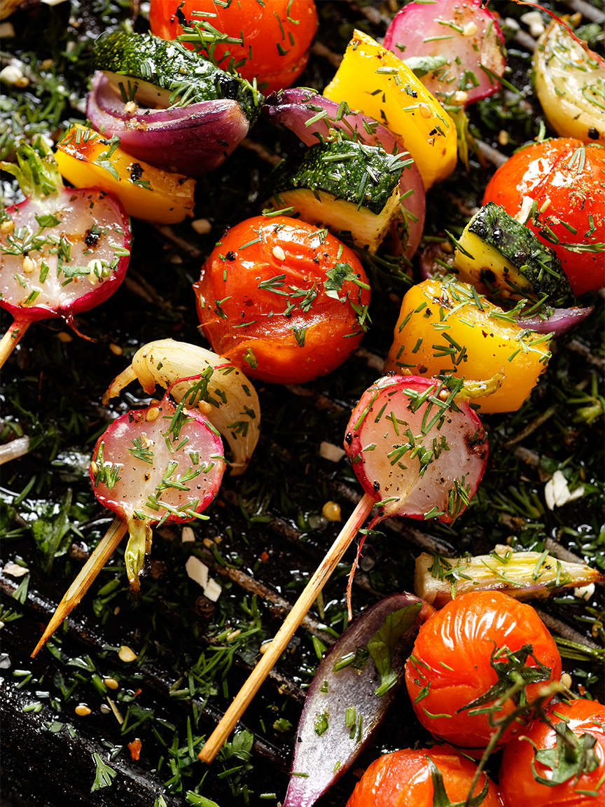 Vegetable kebabs on grill