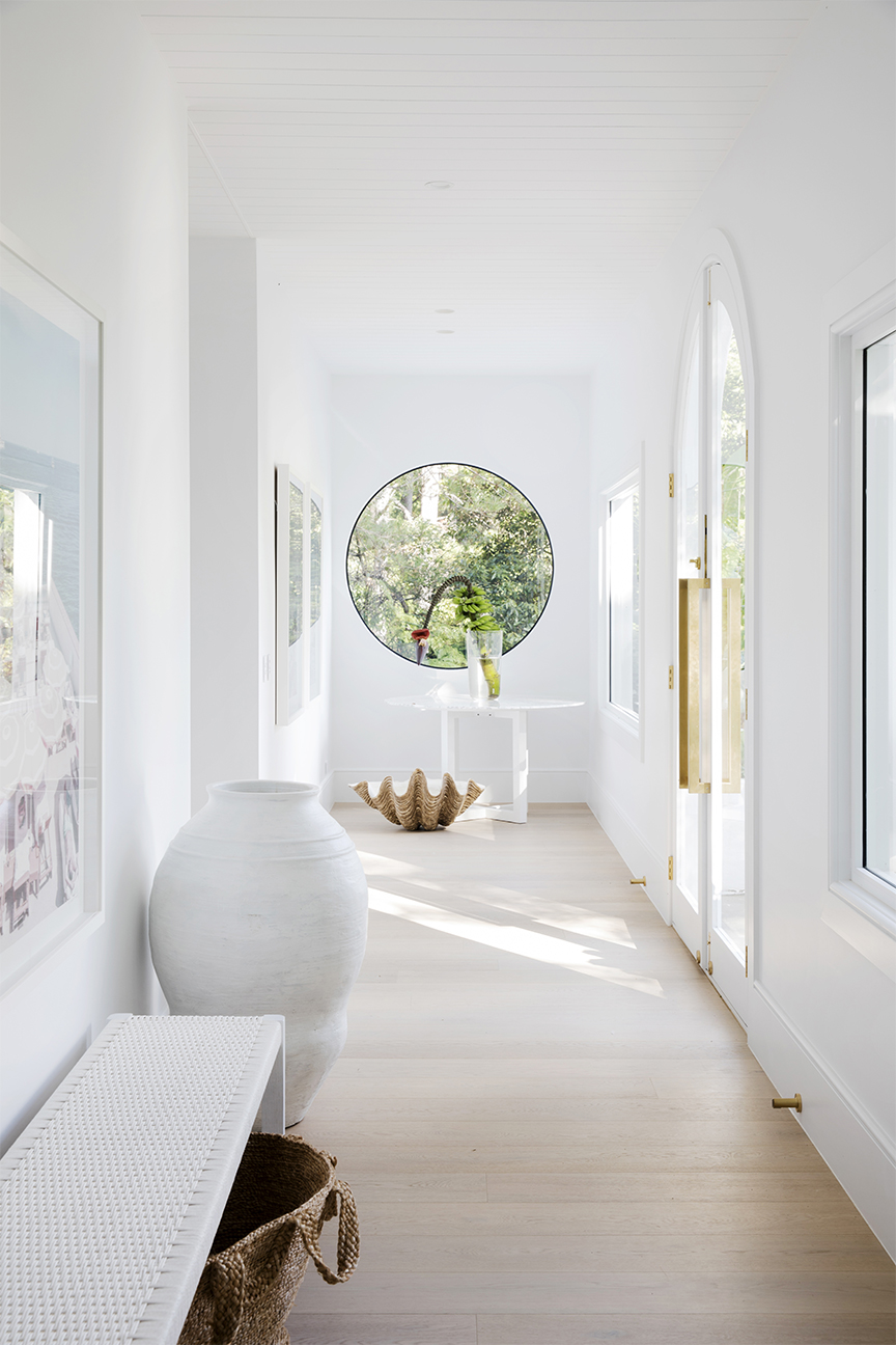 hallway ending with a round window