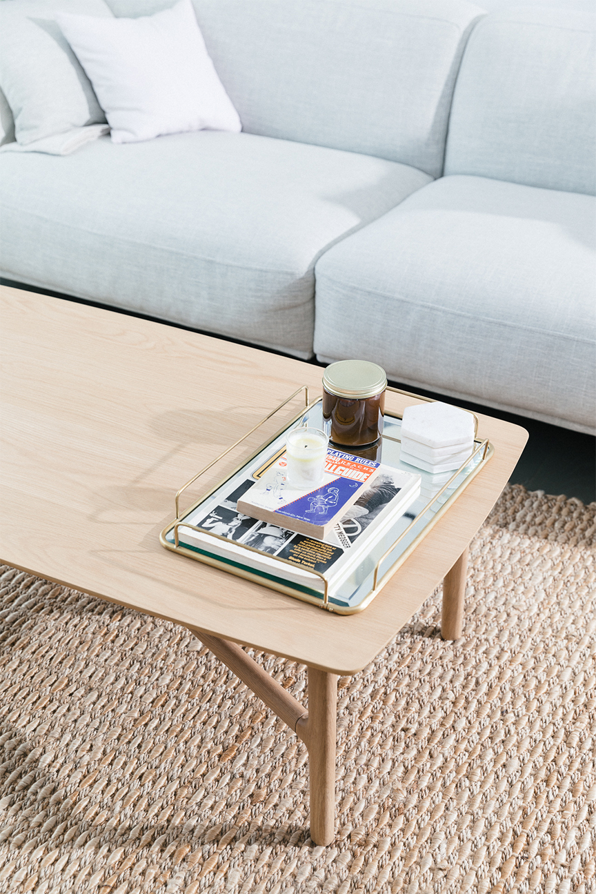 Light blue sofa with birch coffee table