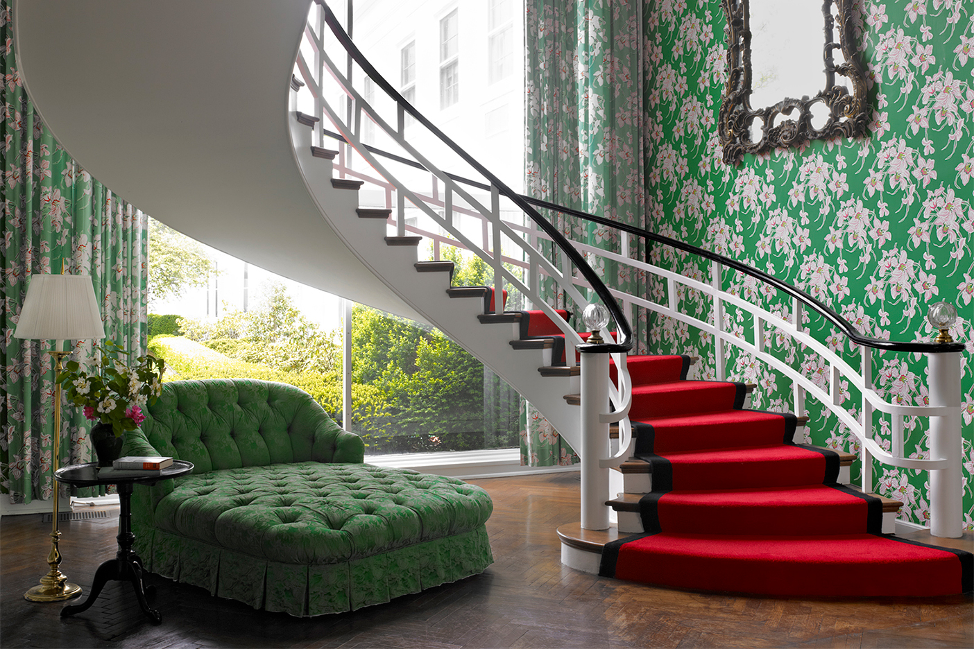 greenbrier hotel staircase with red carpet and green wallpaper