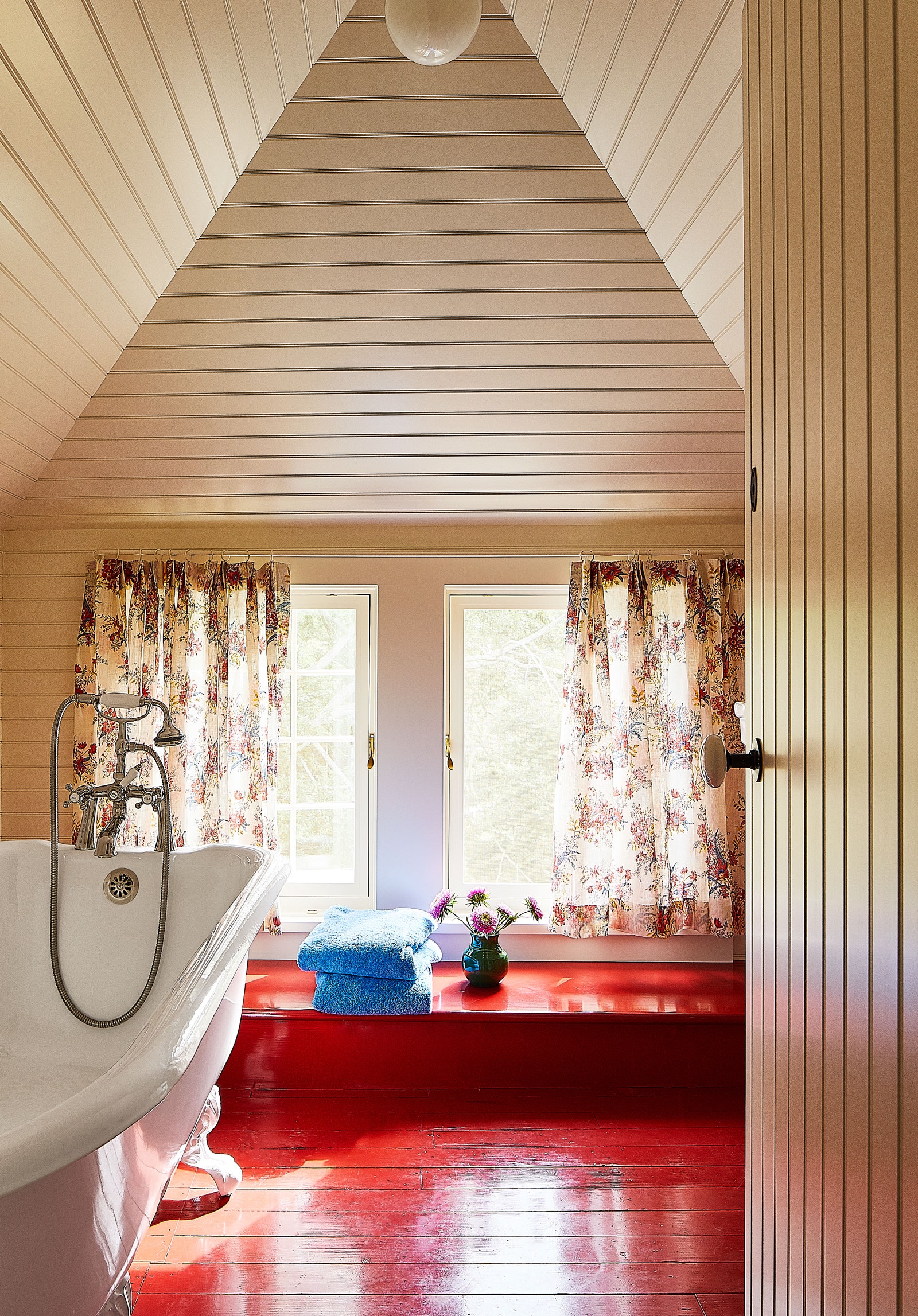 Country bathroom with red painted floors