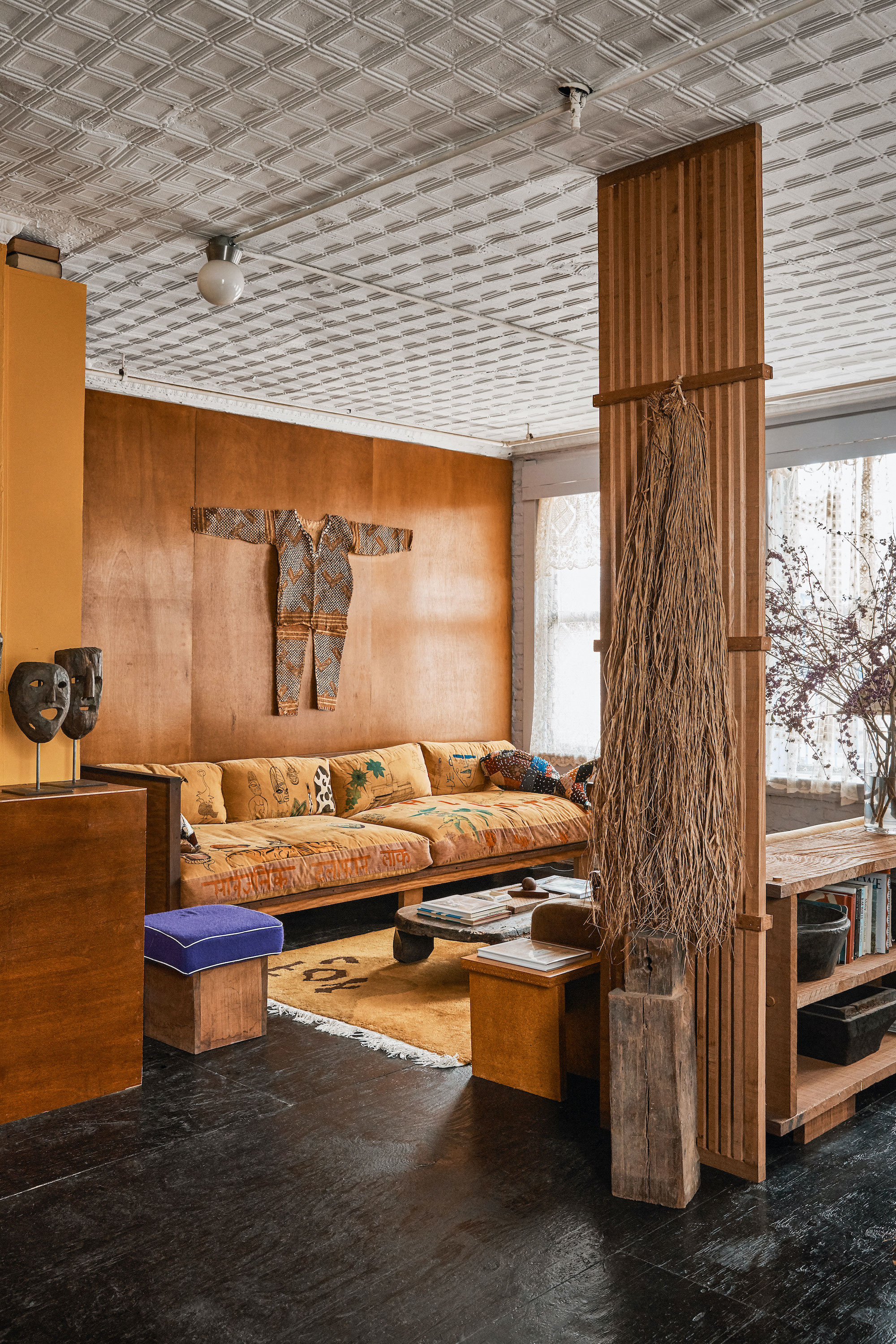 Downtown NYC apartment with black plywood floors