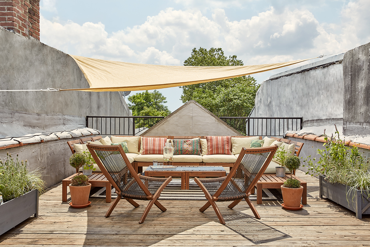 outdoor patio with tent and planters