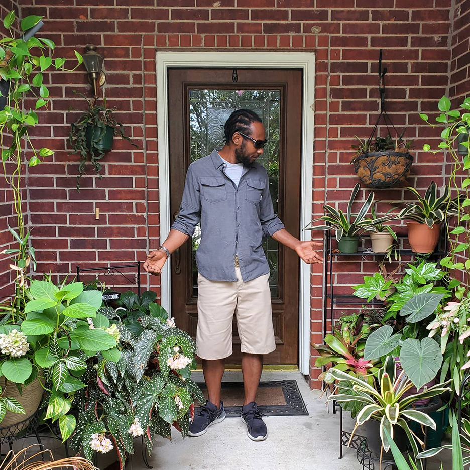 Marcus surrounded by plants