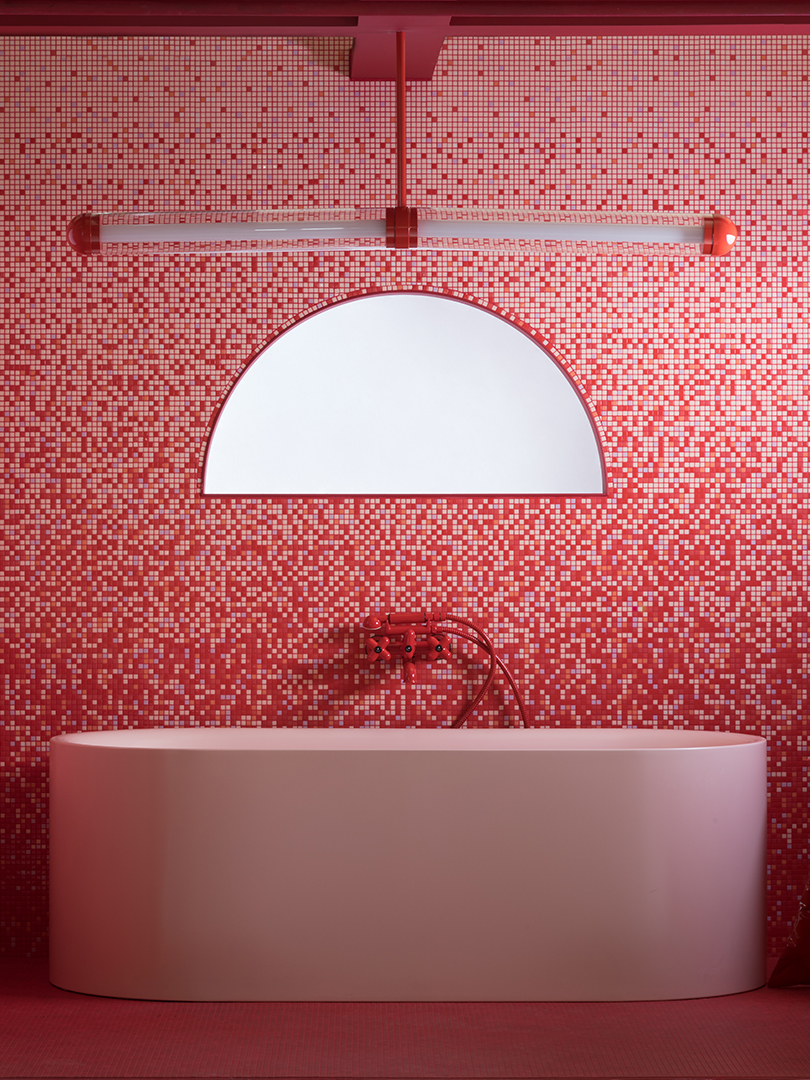red and pink tile bathroom with big pink tub