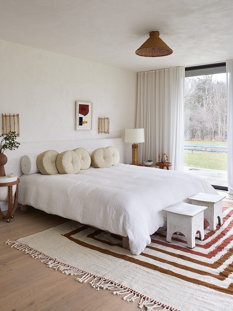 breezy bedroom with white and red tones