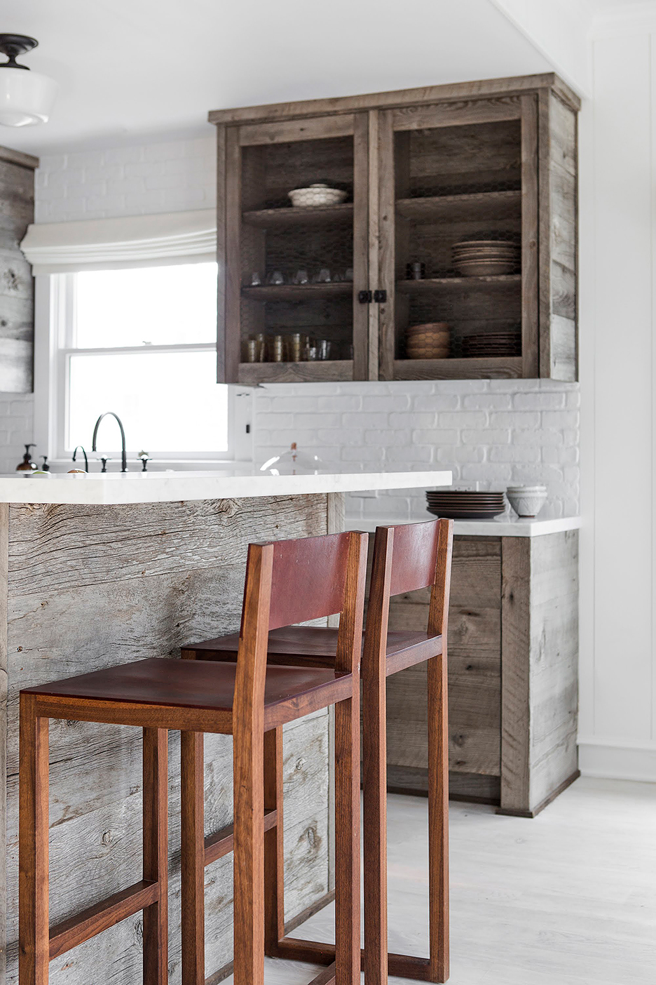 rustic wood kitchen with mesh cabinets