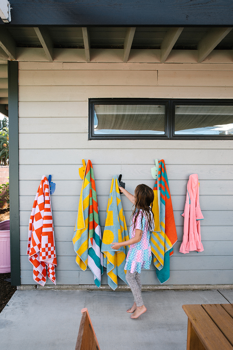 girl hanging up towel